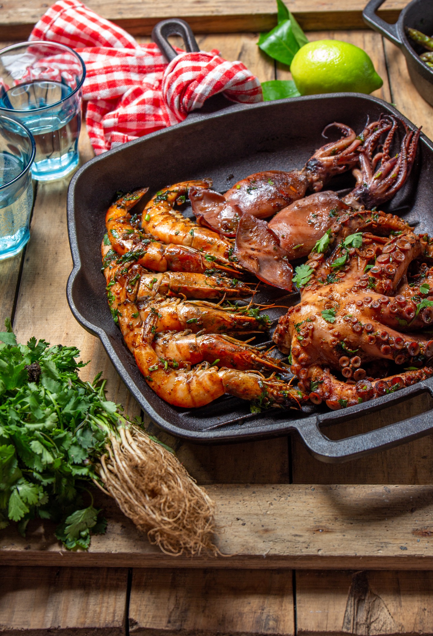 Grilled spimps, squids and octopus in cast iron grill pan.